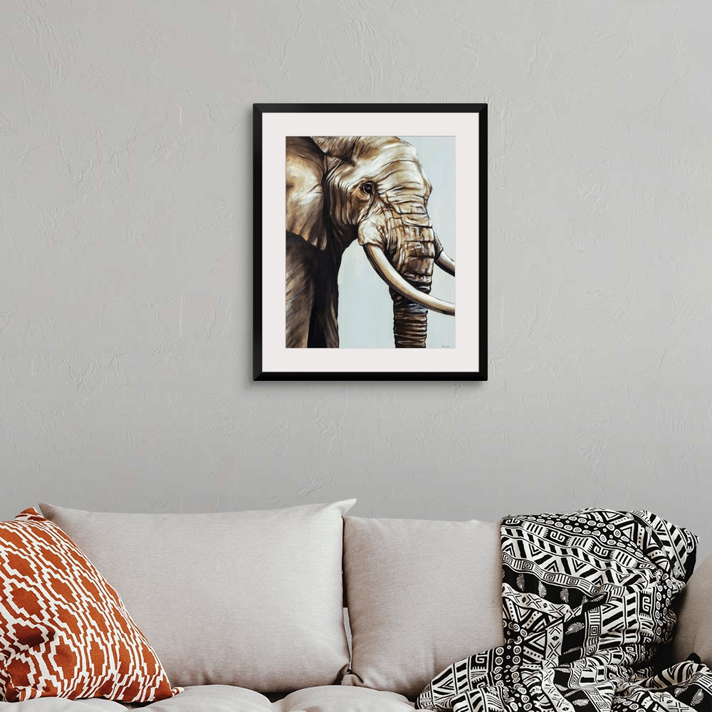 A bohemian room featuring Painted brown and gray portrait of an elephant.
