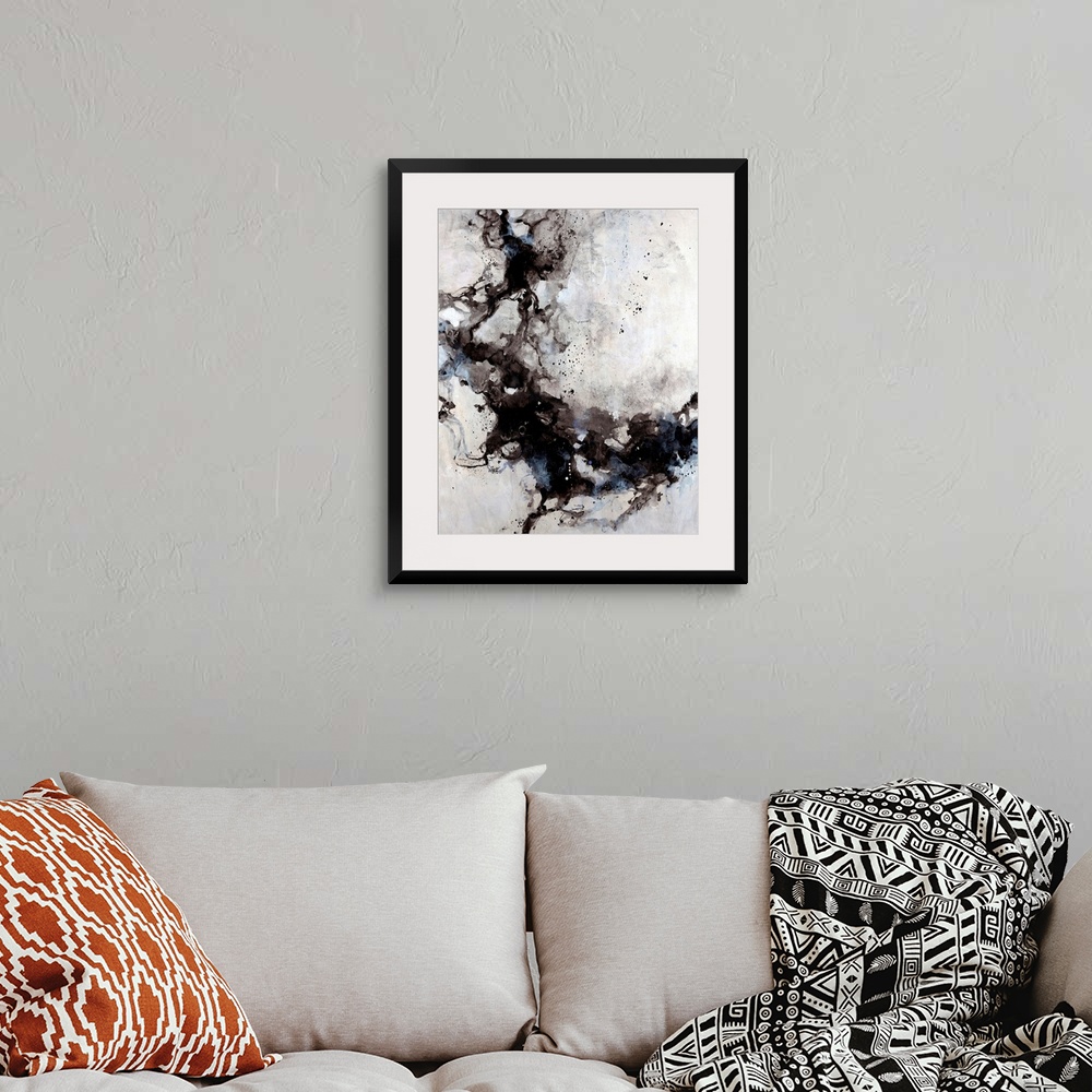 A bohemian room featuring Abstract painting of blended ink splats and splatter with a soft pastel background.