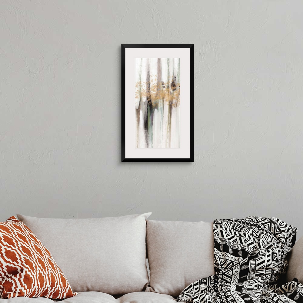 A bohemian room featuring Contemporary abstract painting using tones of pale gray and gold splashes of color.