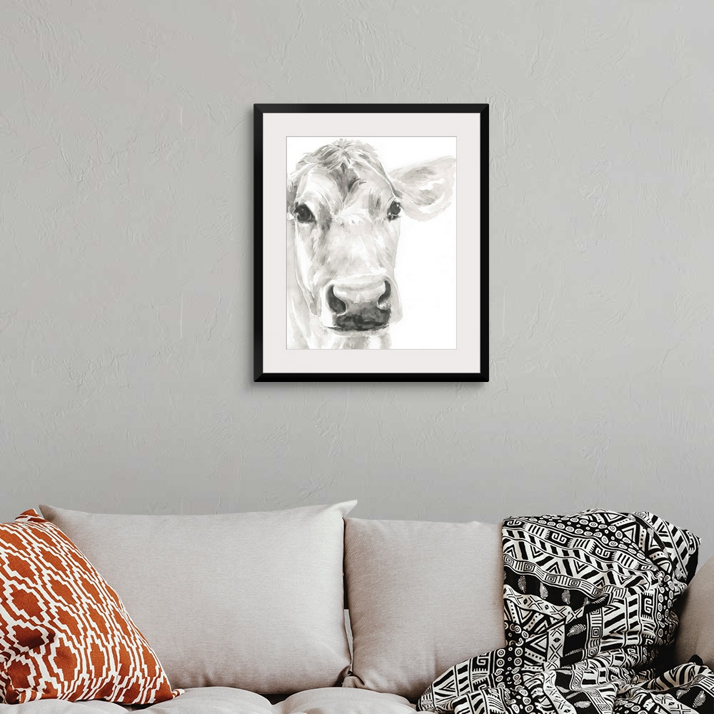 A bohemian room featuring Watercolor portrait of a cow in gray.