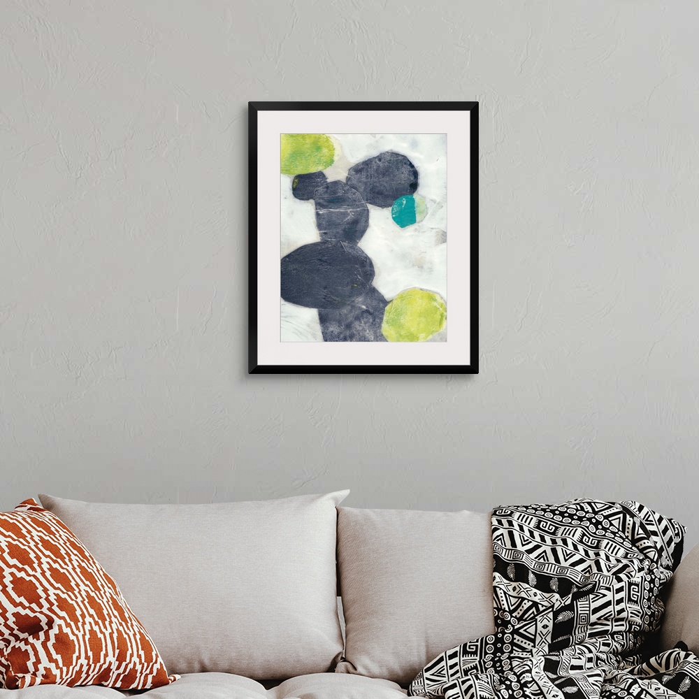 A bohemian room featuring Contemporary painting with abstracted ovular forms in indigo and green on a neutral background.
