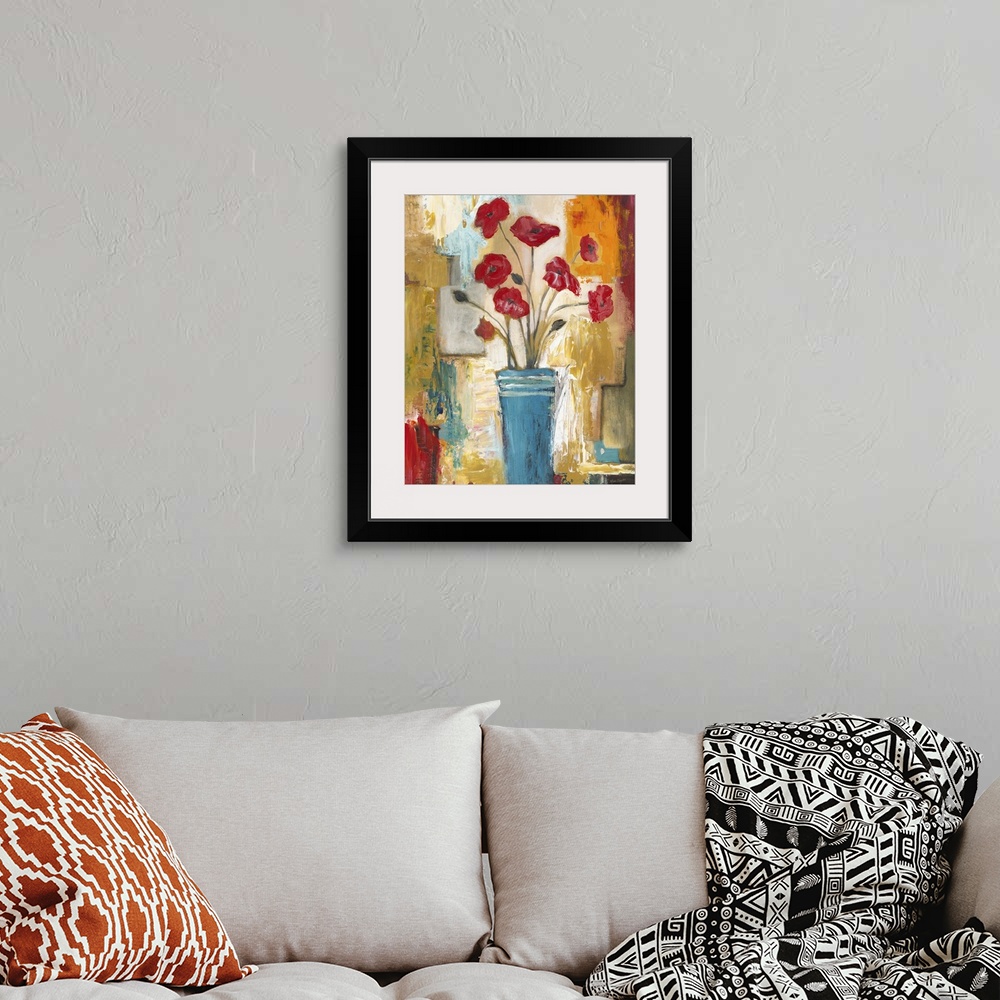 A bohemian room featuring Contemporary still life painting of a blue vase filled with red poppies.