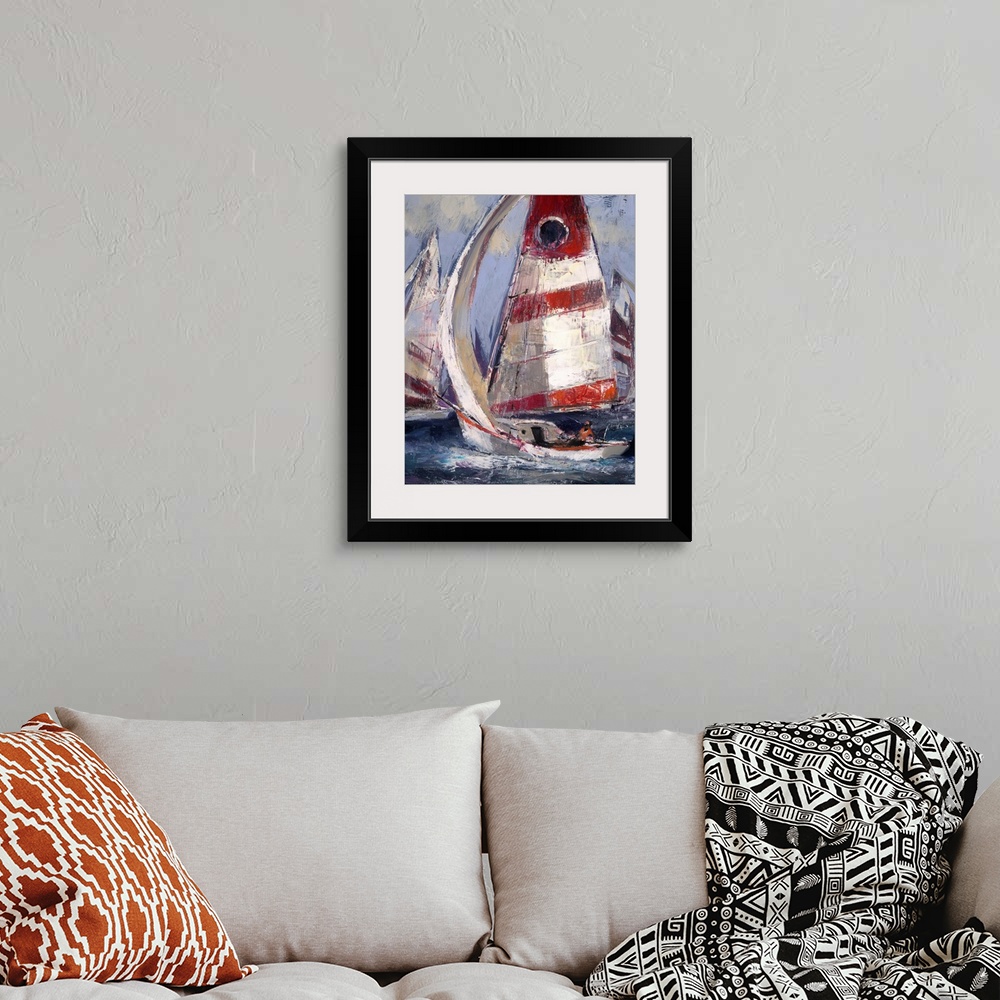 A bohemian room featuring Contemporary painting of sailboats with red white sails in a choppy ocean.