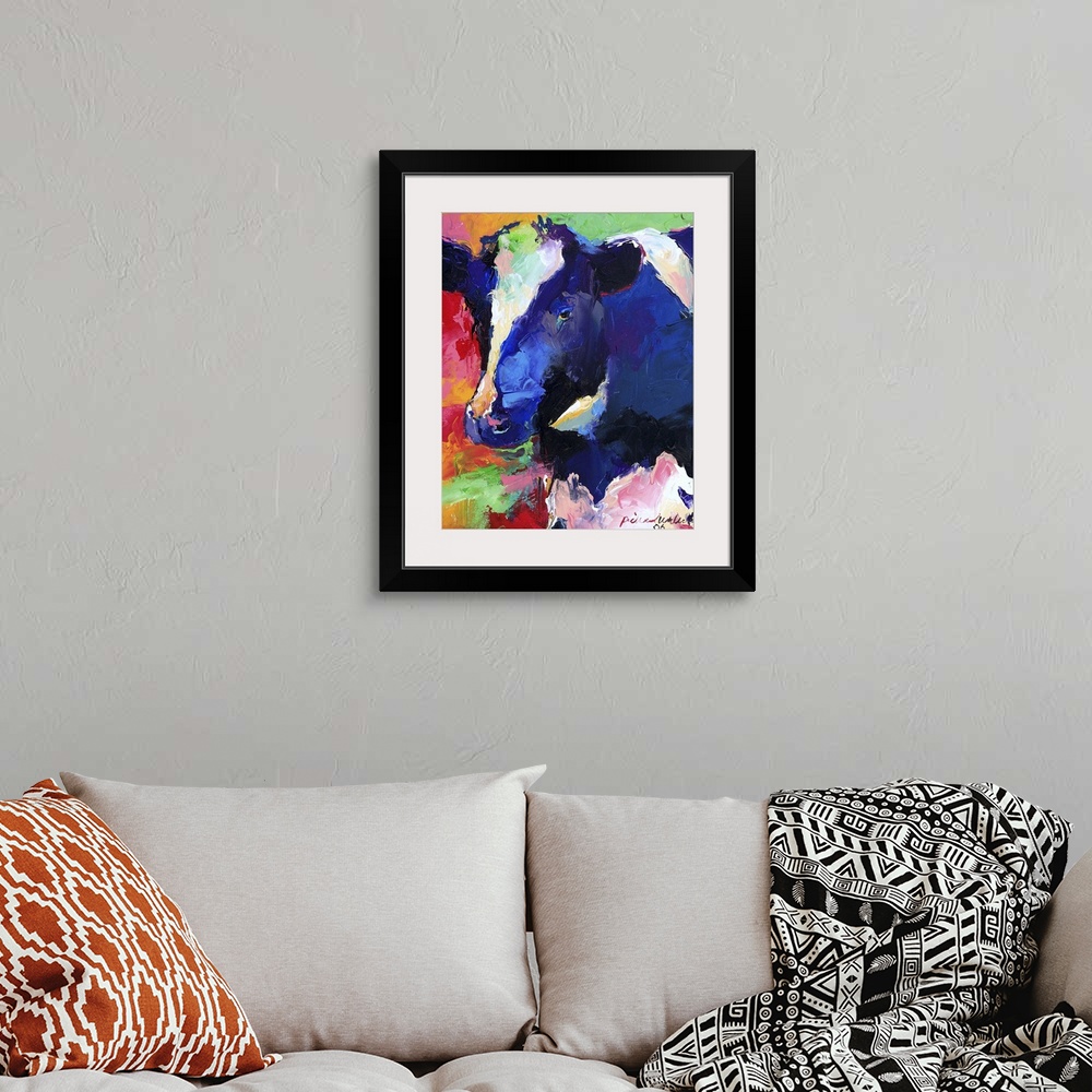 A bohemian room featuring Contemporary vibrant colorful painting of a cow.