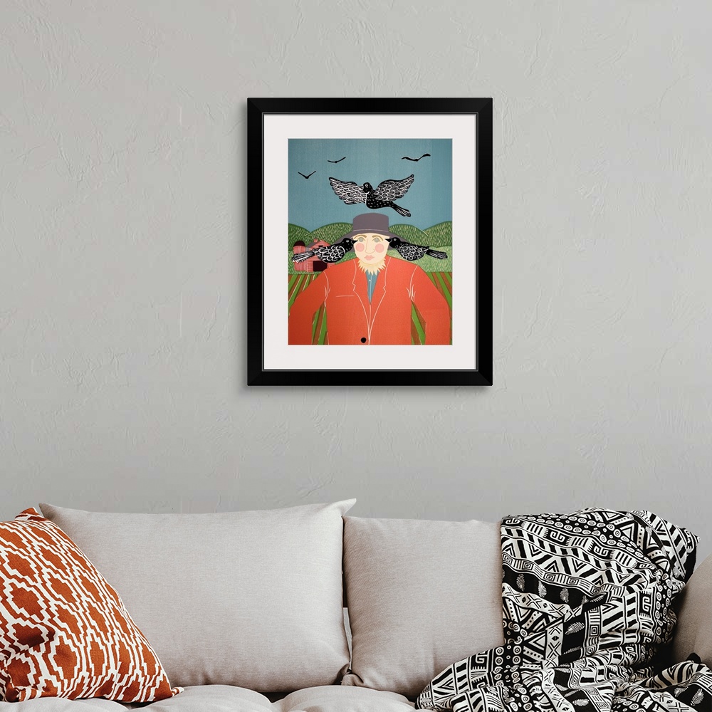 A bohemian room featuring Illustration of a scarecrow in a field surrounded by black crows with a red barn in the background.