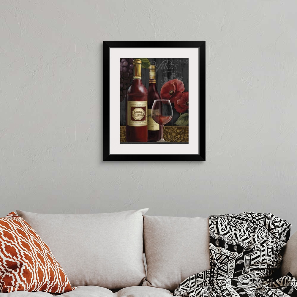 A bohemian room featuring Still life painting of two bottles of wine and a glass of red wine with poppies and grapes in the...