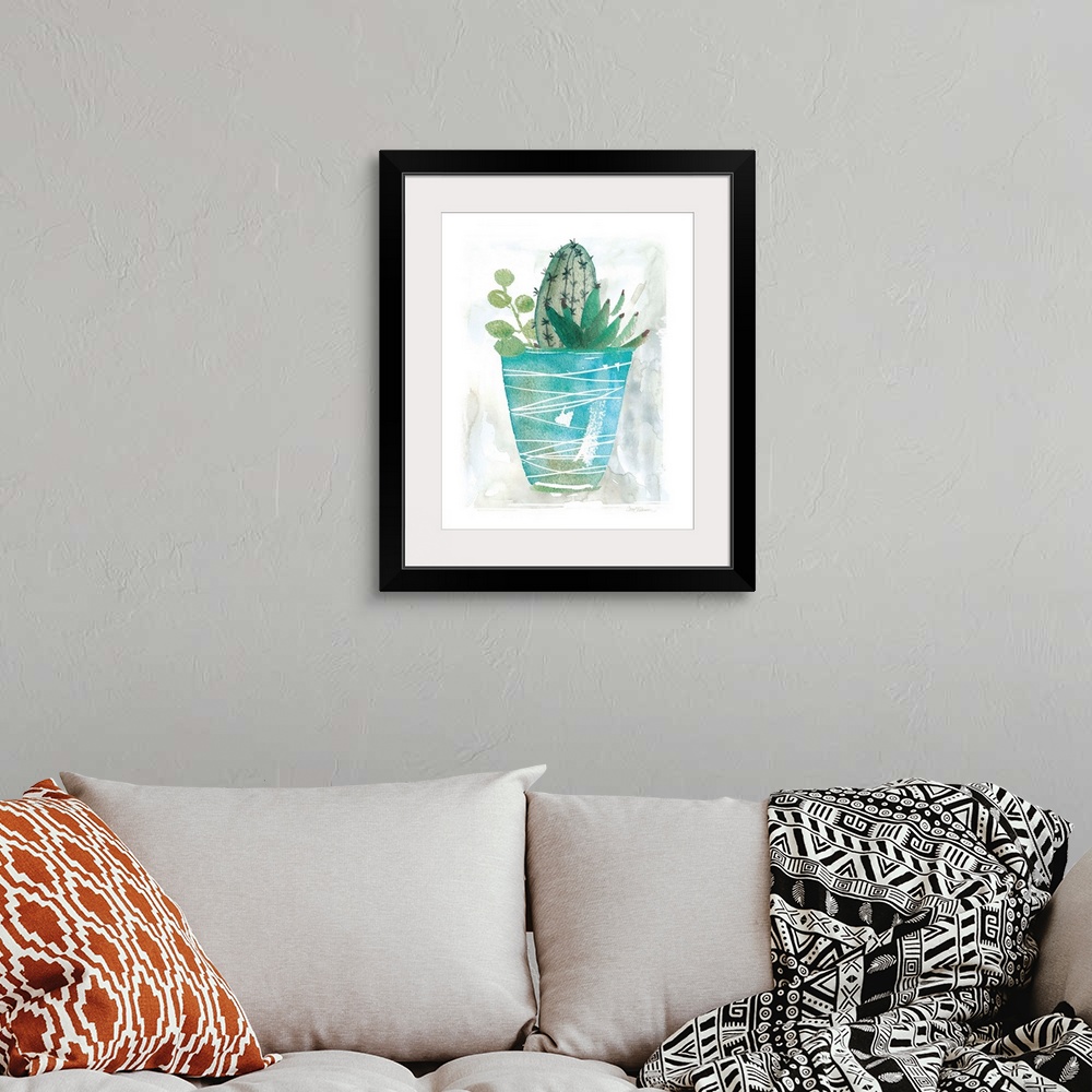 A bohemian room featuring A watercolor painting of a cactus along with other succulents planted in a blue pot with white li...