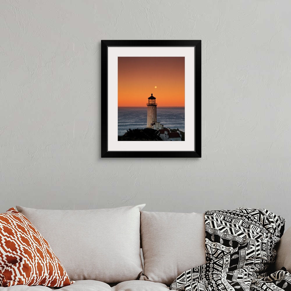 A bohemian room featuring A lighthouse overlooking the ocean at sunset, Washington.