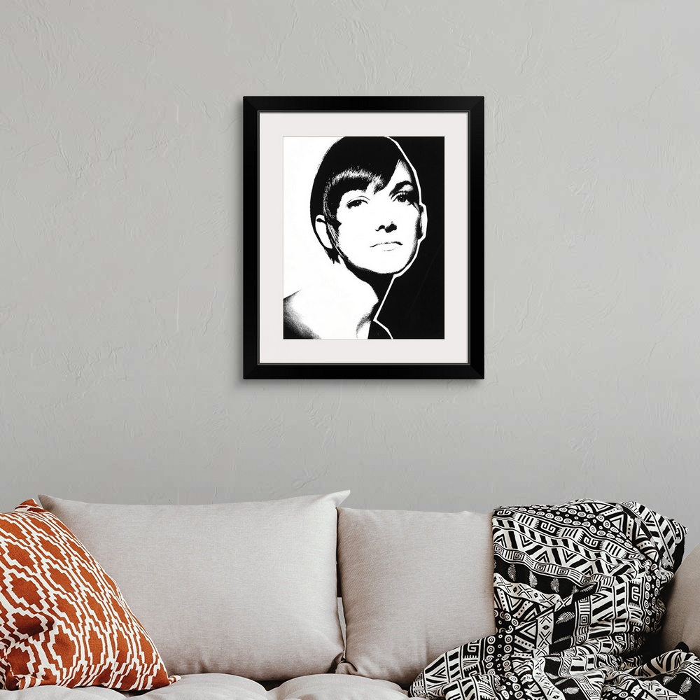 A bohemian room featuring Black and white illustration of a woman with short hair.