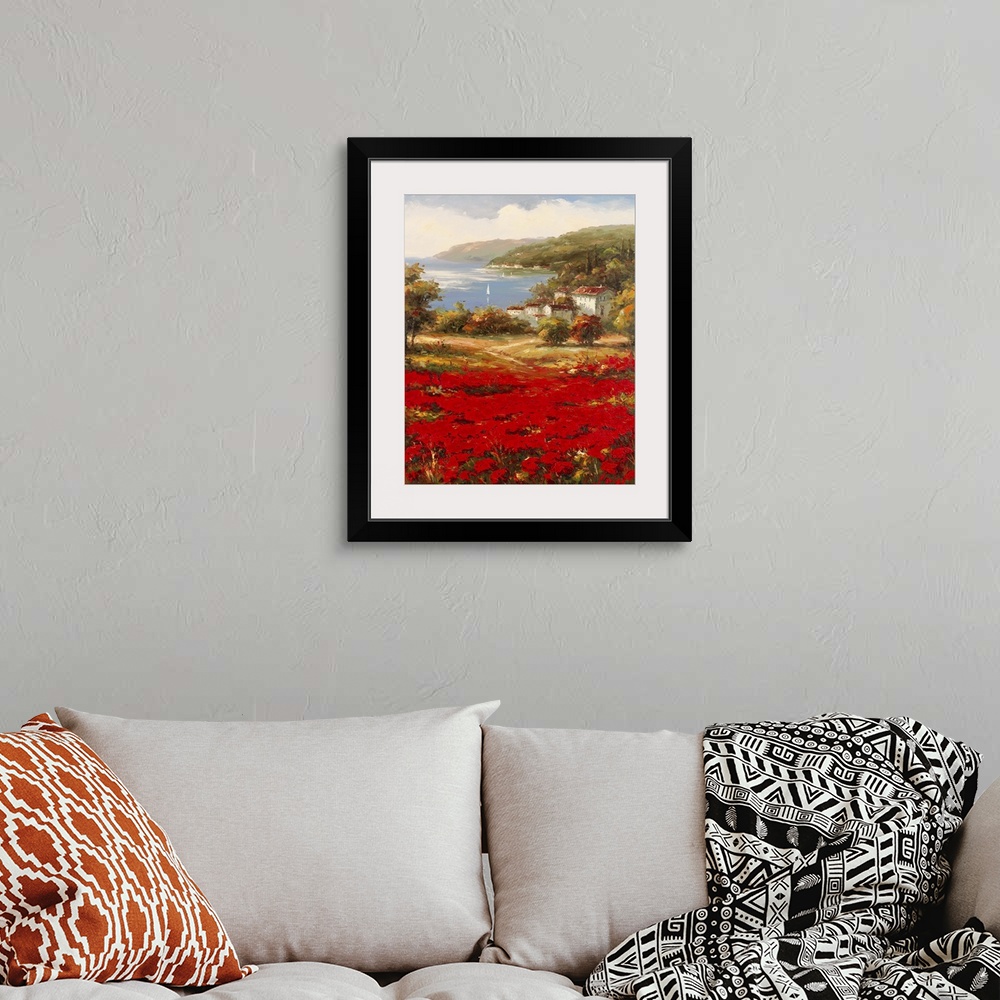 A bohemian room featuring Contemporary painting of an idyllic rural European village scene, with vibrant red flowers in the...