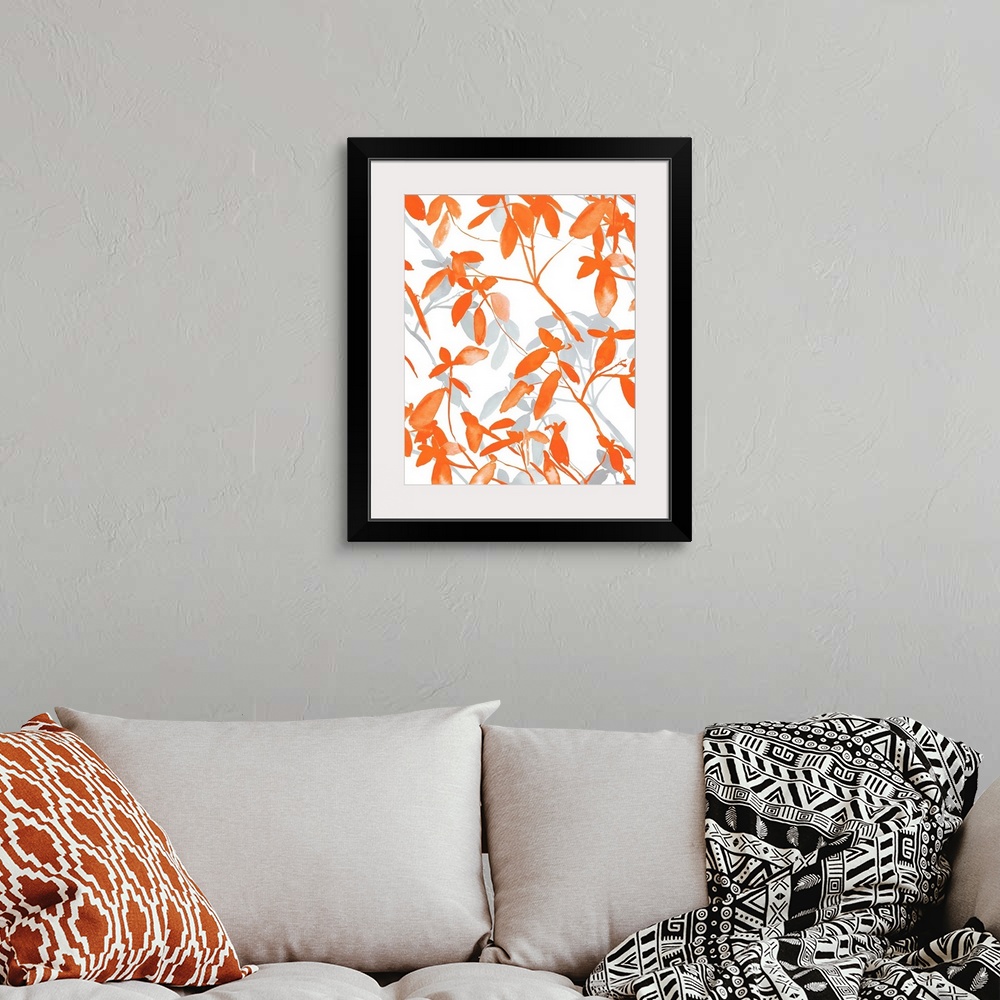 A bohemian room featuring An abstract watercolor painting of branches of leaves in colors of orange and gray.