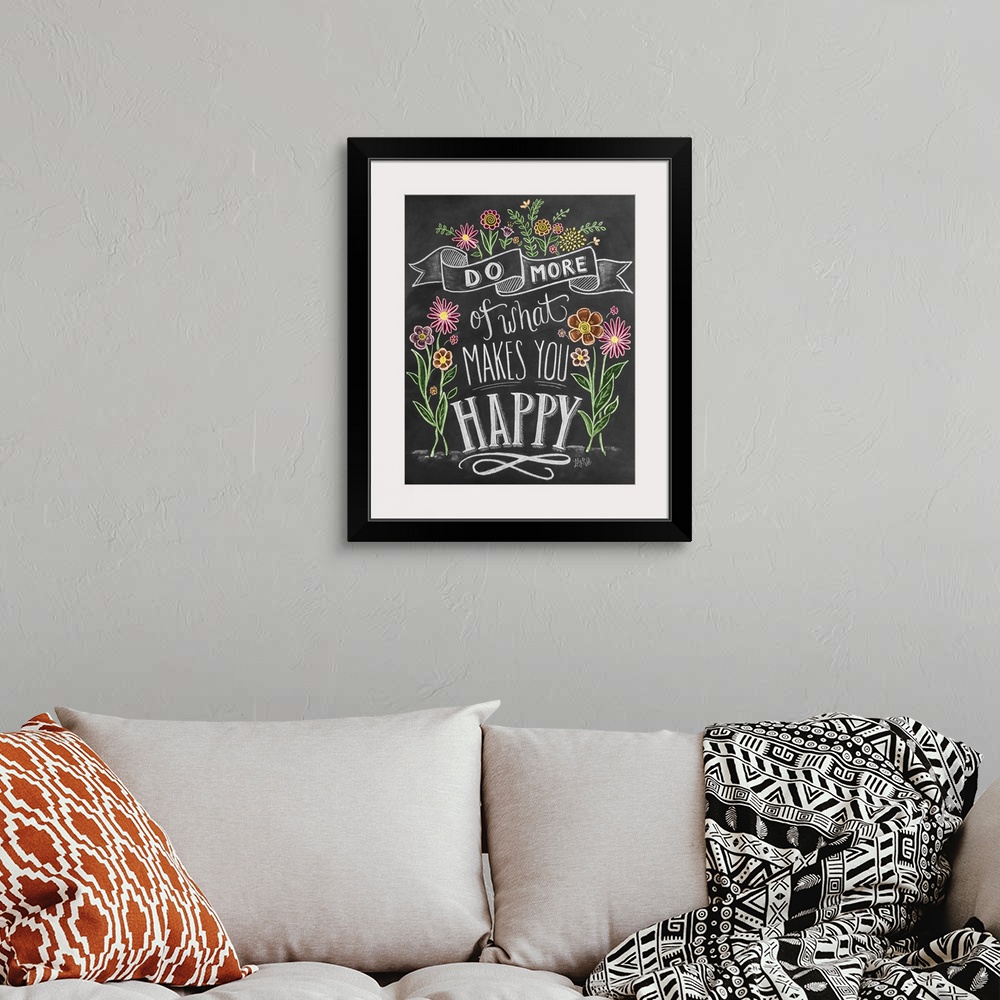 A bohemian room featuring "Do more of what makes you happy" handwritten and illustrated with flowers.
