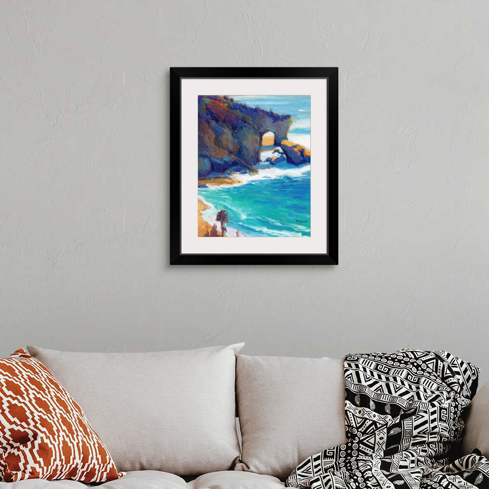 A bohemian room featuring Contemporary painting of a rocky cliff and a beach with vivid blue water.