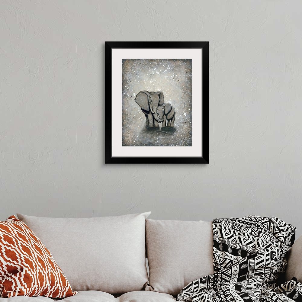 A bohemian room featuring Painting of a mother elephant hugging her baby.