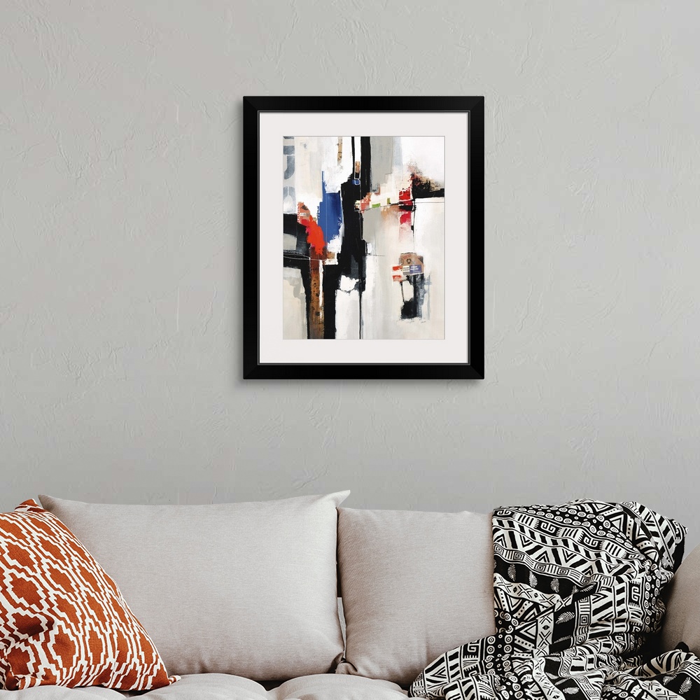 A bohemian room featuring Contemporary abstract painting using bold colors and harsh lines against a neutral background.