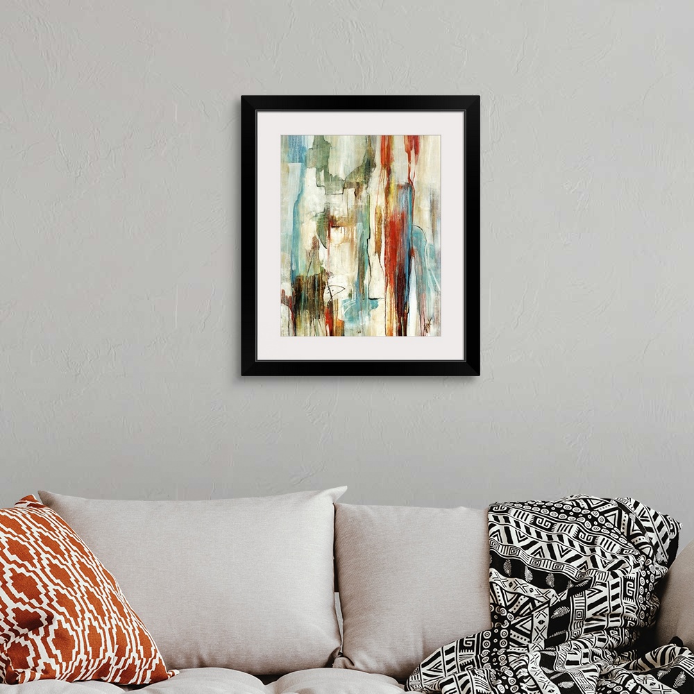 A bohemian room featuring A large abstract piece with muted colors that move in a vertical direction and drip down toward t...