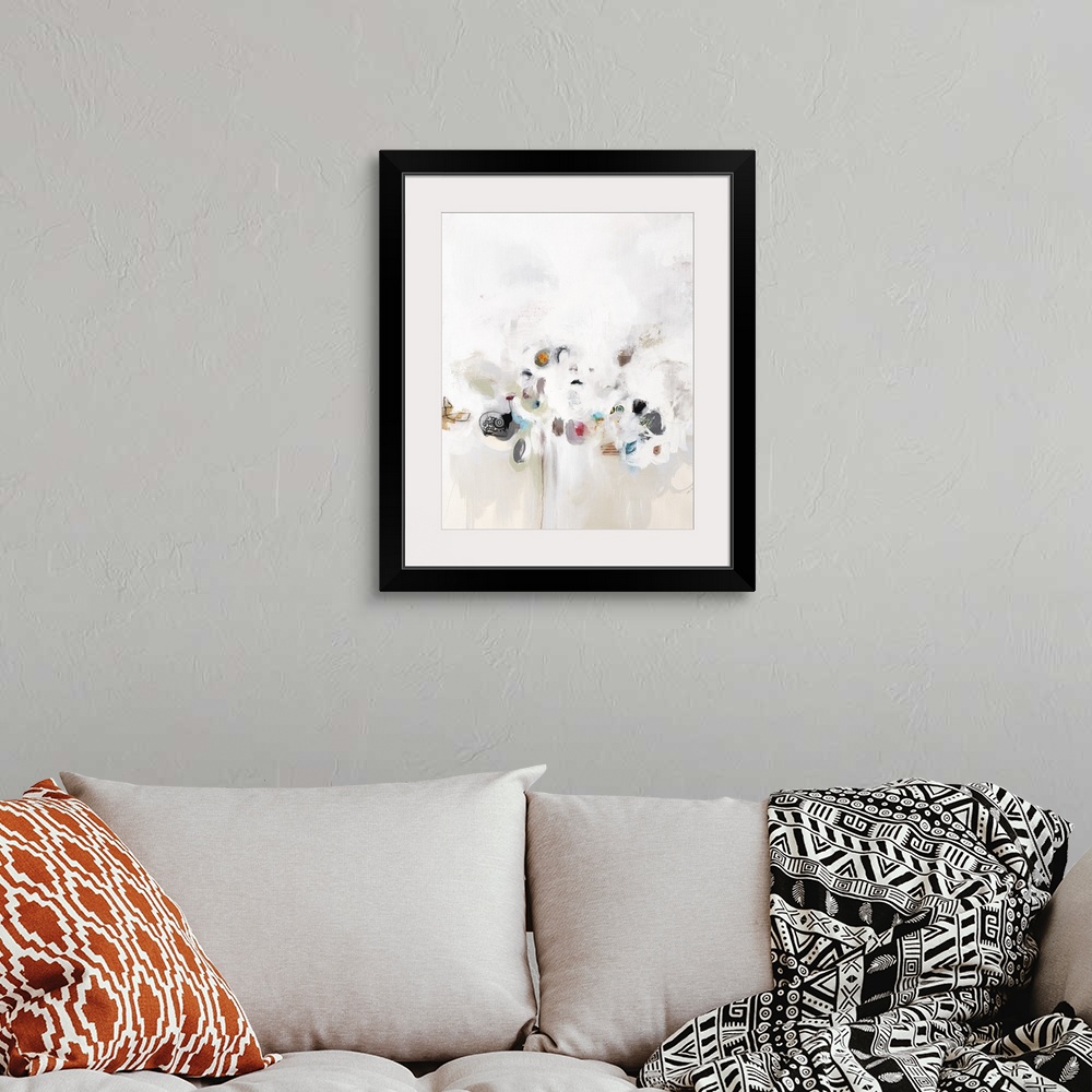 A bohemian room featuring Contemporary artwork with small spots of color hiding in white.