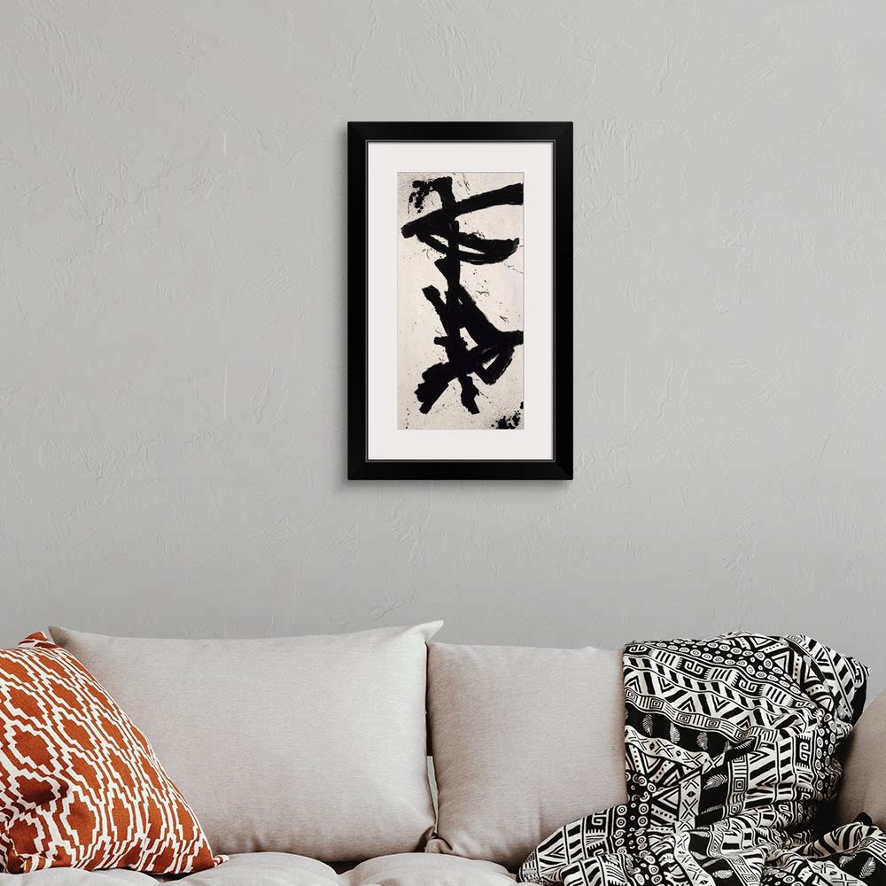 A bohemian room featuring Contemporary abstract painting of bold black aggressive strokes resembling Oriental script charac...