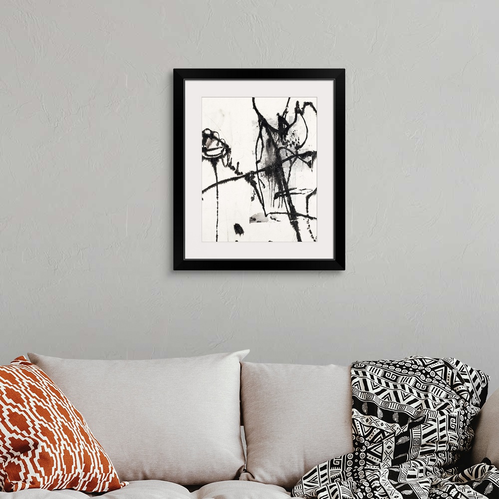 A bohemian room featuring Contemporary abstract painting of black painted lines against a white background.