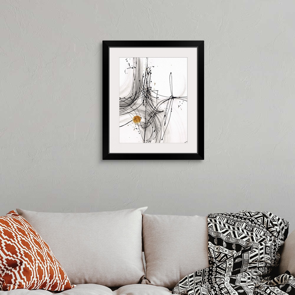 A bohemian room featuring Abstract painting using thin black lines to create fluid movement, with a little gold circle towa...