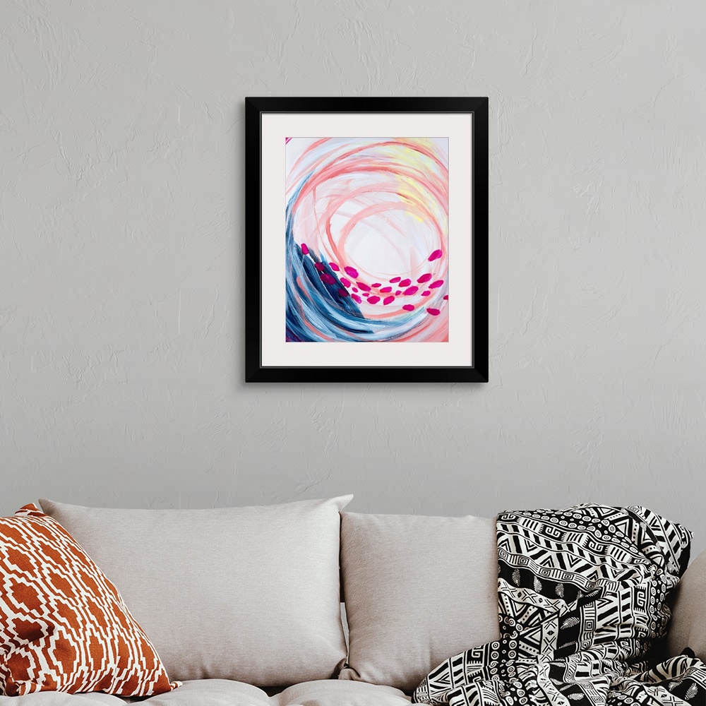 A bohemian room featuring Contemporary abstract painting in vivid rainbow colors, swirling in the center, with a row of pin...