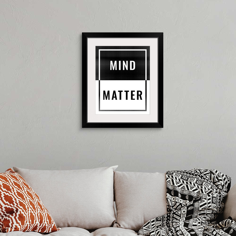 A bohemian room featuring Typography artwork that symbolizes "Mind Over Matter" sentiment.