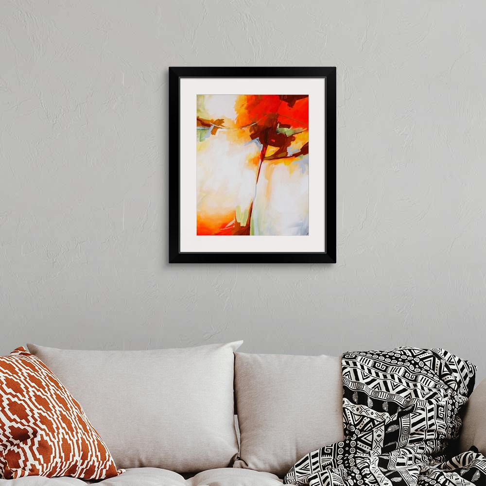 A bohemian room featuring Abstract painting done with muted, pastel colors and pops of bright orange-red.