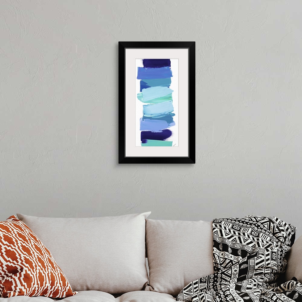 A bohemian room featuring Vertical contemporary painting of shades of blue stacked in a line.