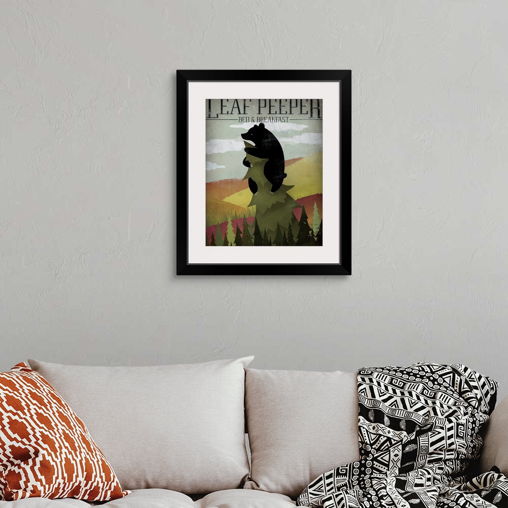 A bohemian room featuring Portrait artwork on a large canvas of a black bear hanging onto the top of a tall pine tree, on a...