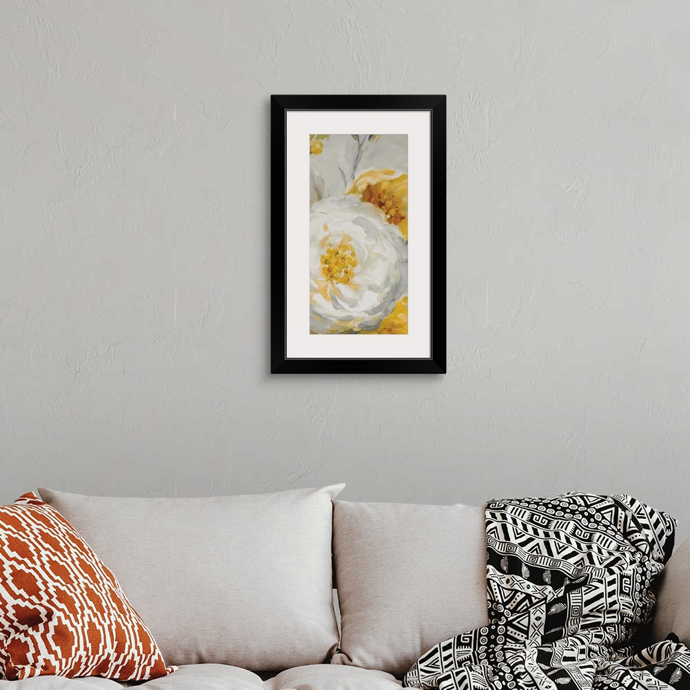 A bohemian room featuring Vertical contemporary painting of large yellow and white flowers against a gray backdrop.