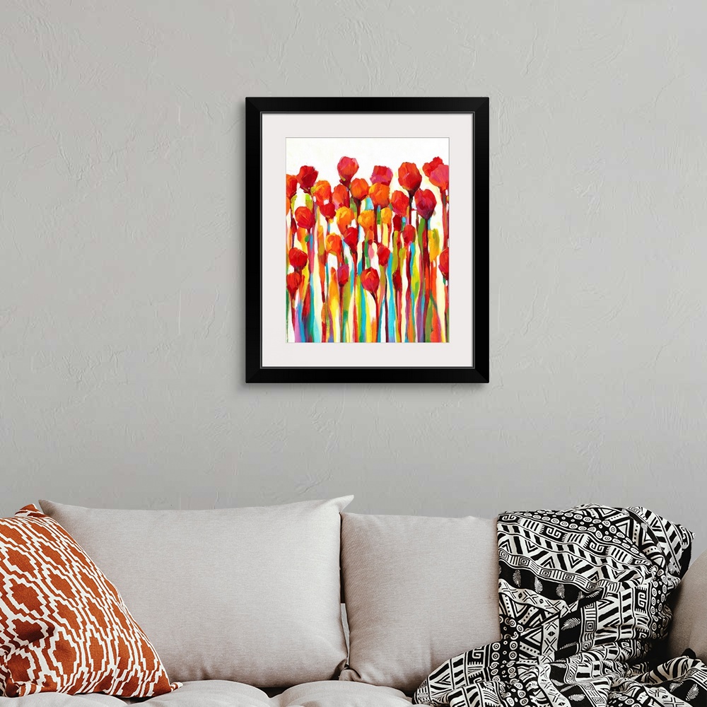A bohemian room featuring Bright contemporary painting of red flowers with rainbow stems.