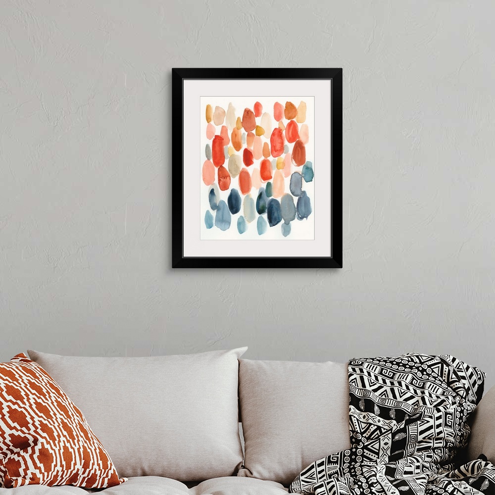 A bohemian room featuring Watercolor abstract with oblong shapes in indigo, coral, and orange colors on a white background.