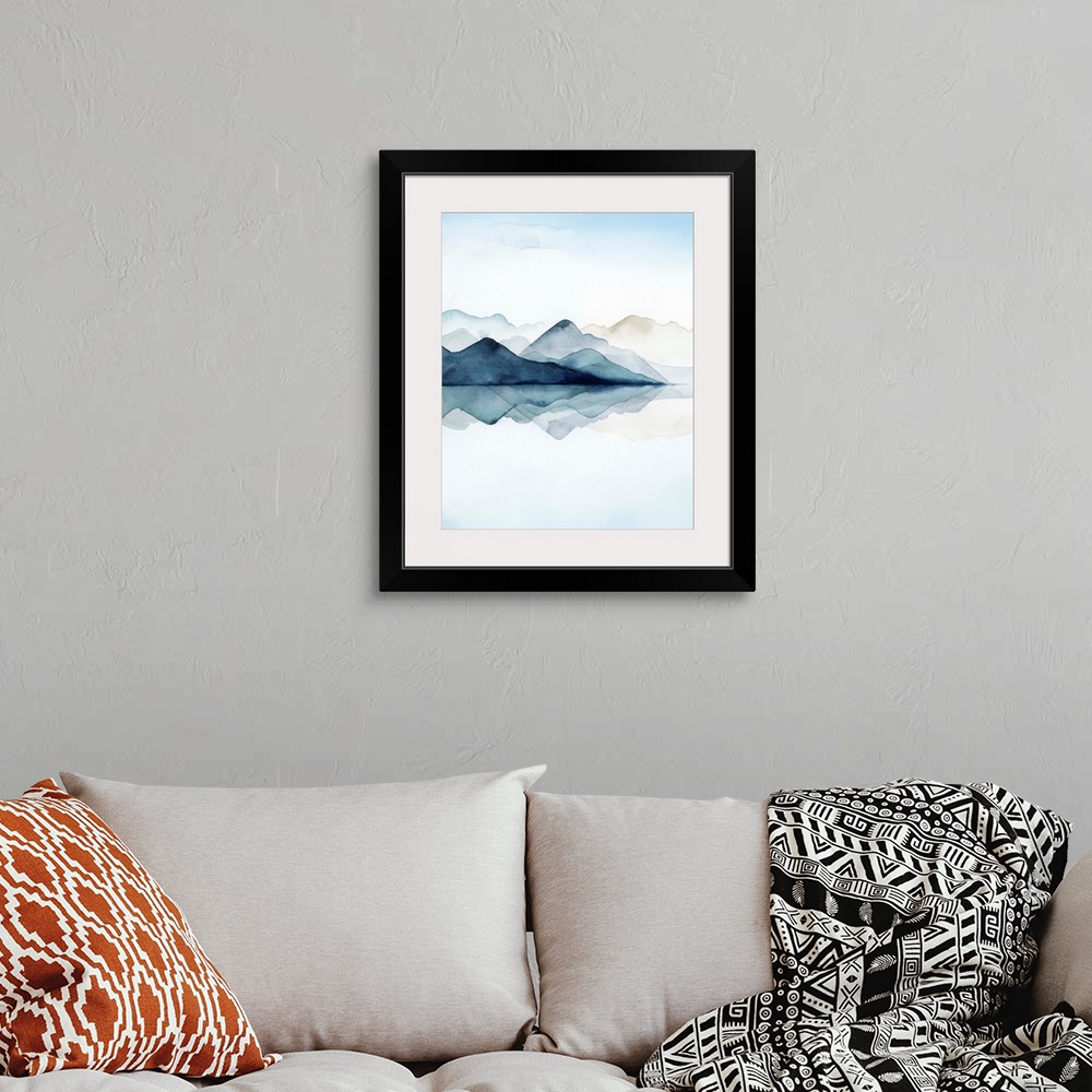 A bohemian room featuring Watercolor painting of misty mountains reflected in glacial waters.