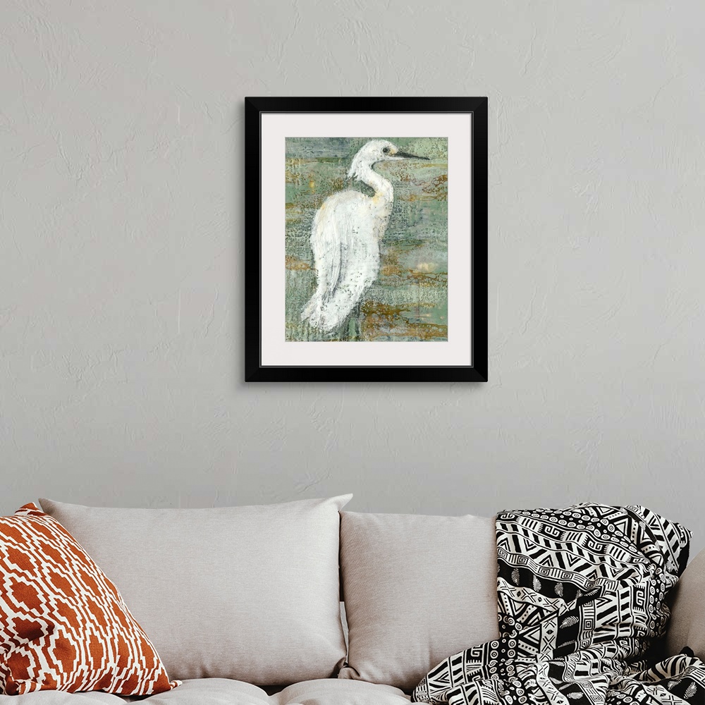 A bohemian room featuring Contemporary artwork of a white heron against a weathered dark background.