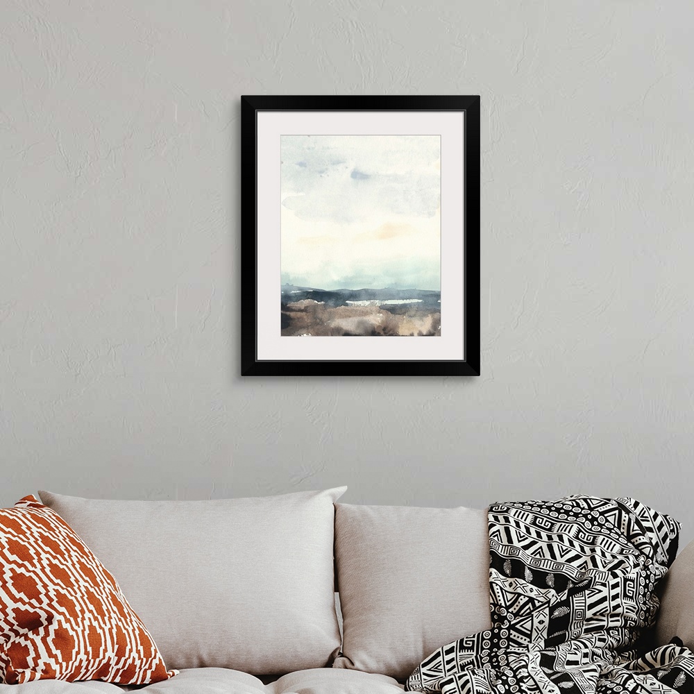 A bohemian room featuring Watercolor seascape painting with a bright sky.