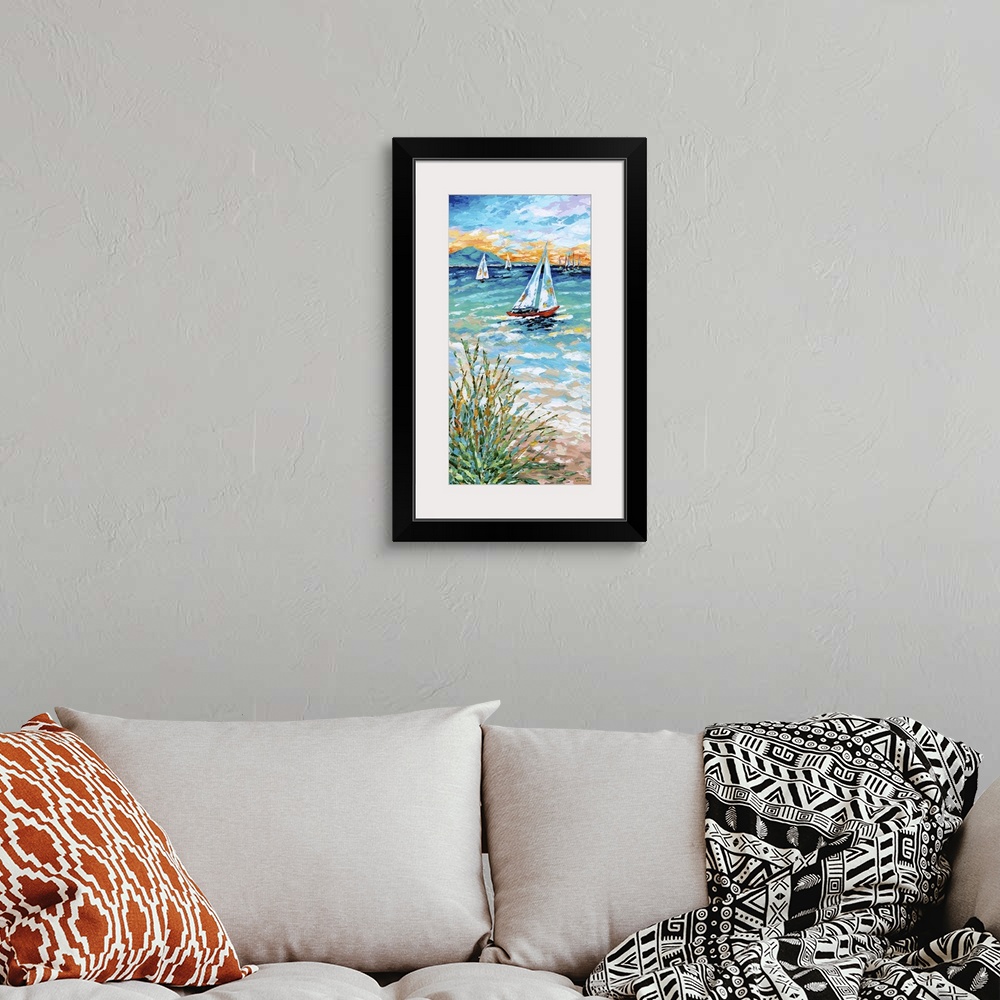 A bohemian room featuring Contemporary ocean scene with three sailboats on the sea and beach grass on the shore.
