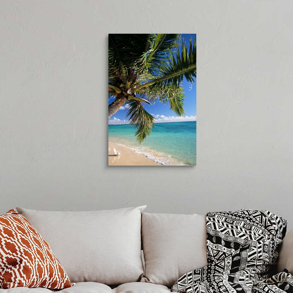Distant View Of White Beach Chair In Shoreline Waters With Palm Tree ...