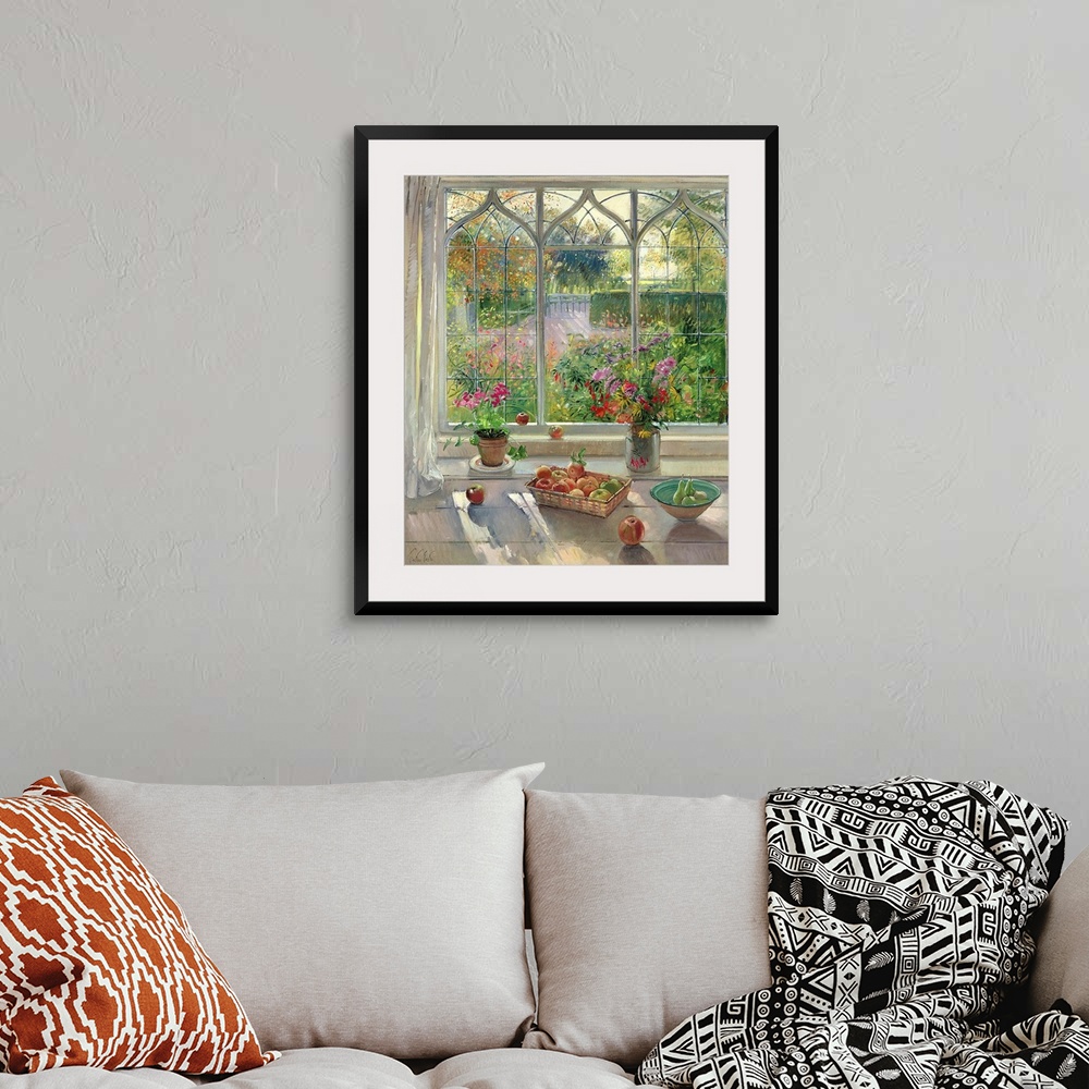 A bohemian room featuring This large painting has fruit baskets and flower pots sitting on a window sill that looks out ove...