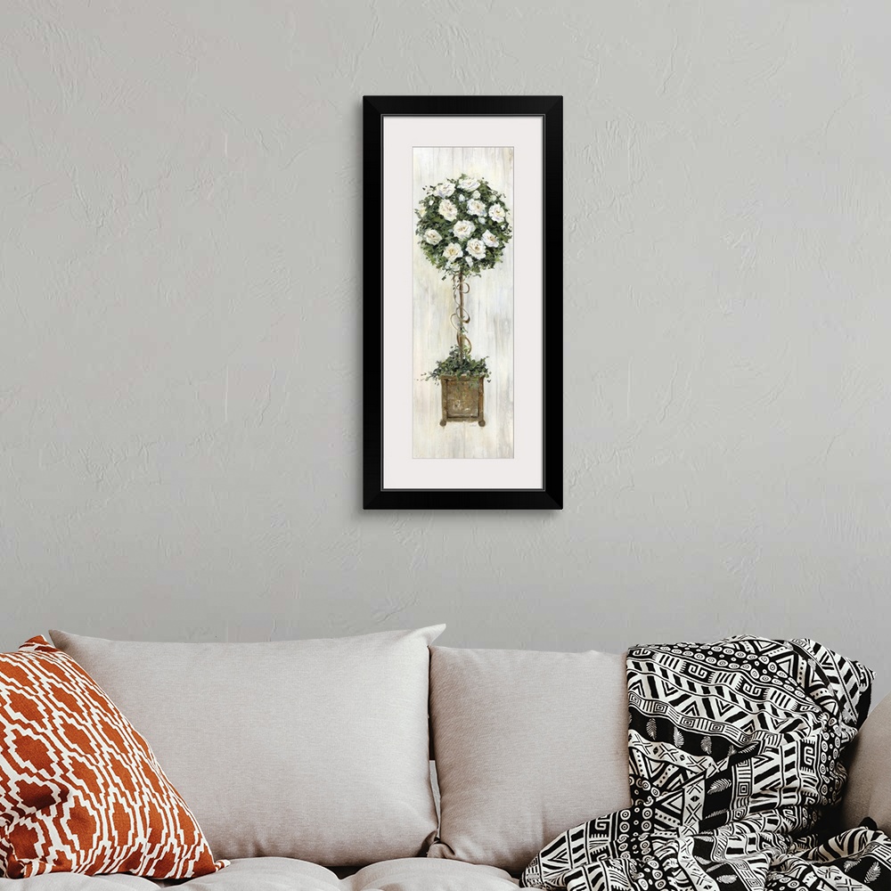 A bohemian room featuring A contemporary still life painting of a topiary with white flowers and a wood grain background.