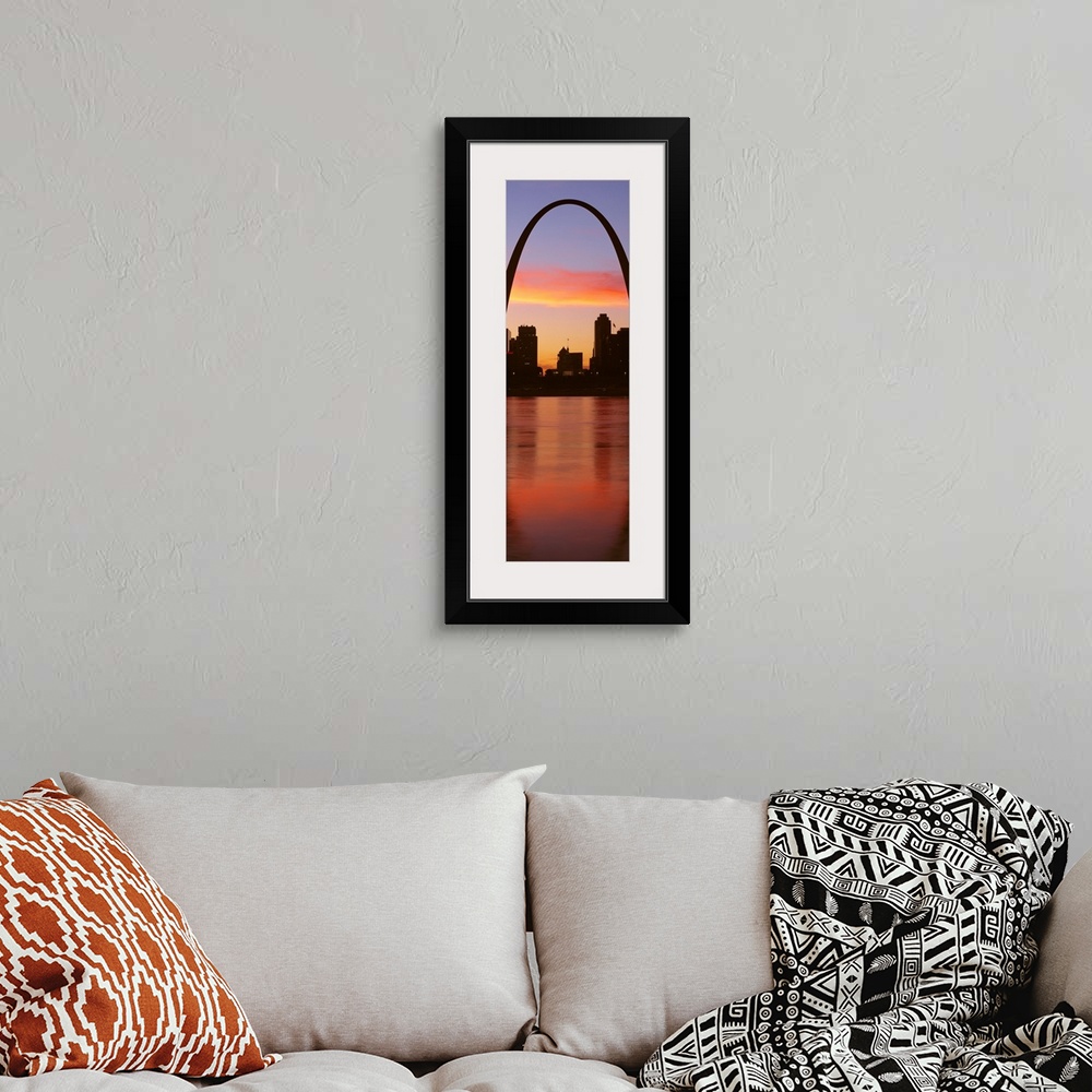 A bohemian room featuring Vertical photograph on a big canvas of the Gateway Arch over St. Louis, Missouri, at sunrise.