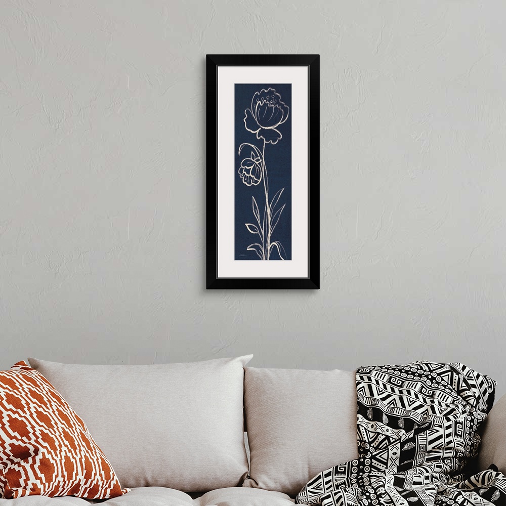A bohemian room featuring Tall, rectangular painting that has white outlines of two flowers with long stems on an indigo ba...