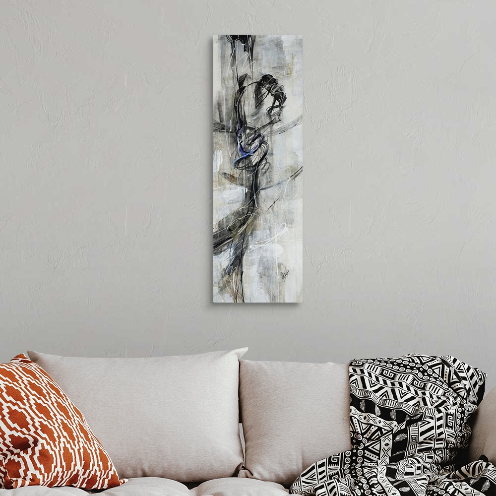 A bohemian room featuring Figurative art work of a female dancer in various shades of black and gray.