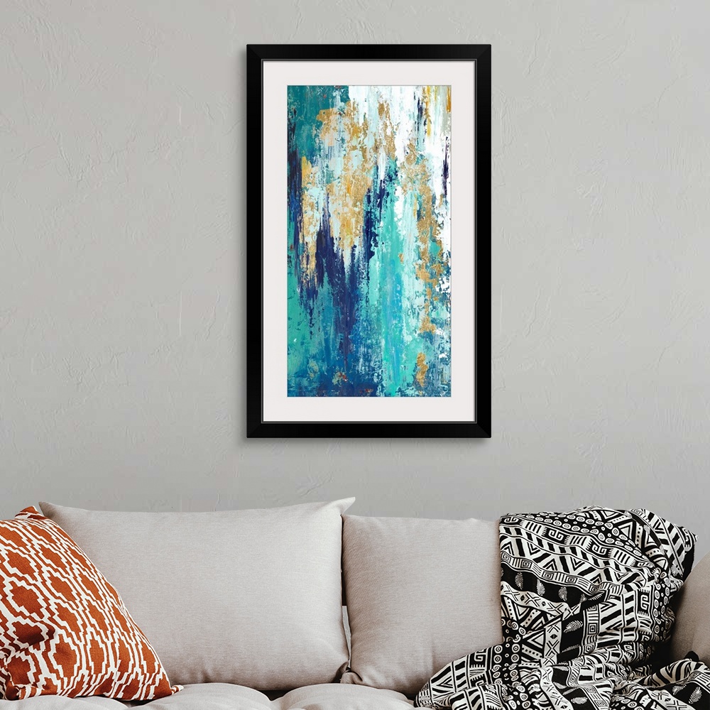 A bohemian room featuring Tall abstract painting with long vertical brushstrokes of color in shades of blue with some white...