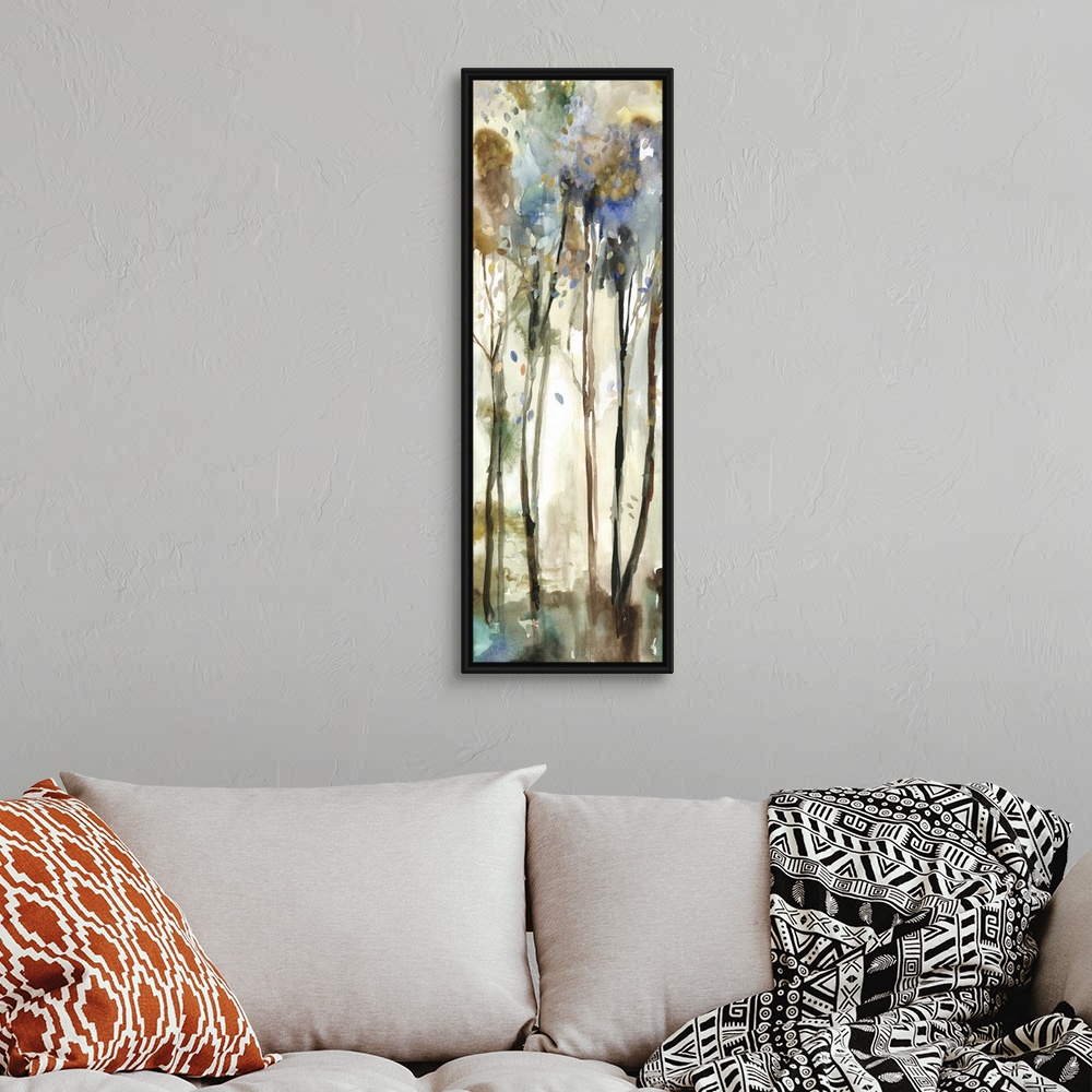 A bohemian room featuring Watercolor artwork of a forest with tall, thin trees.