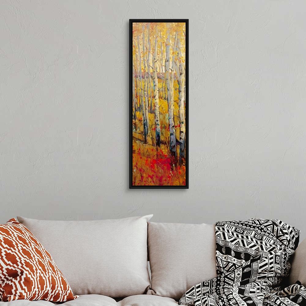 A bohemian room featuring This vertical painting of white barked trees in a narrow landscape of autumn colored grass.
