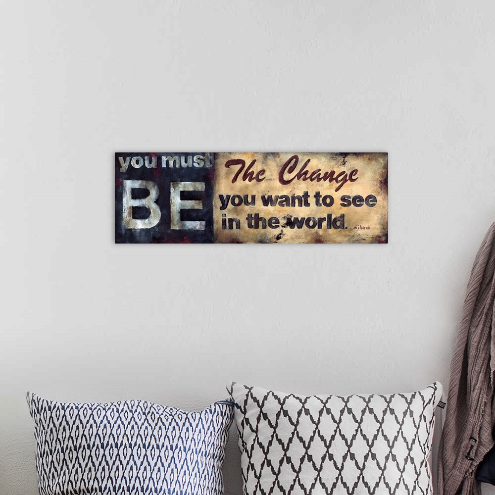 A bohemian room featuring Design with the text "You Must Be The Change You Want To See In The World. - Ghandi" done is a ru...