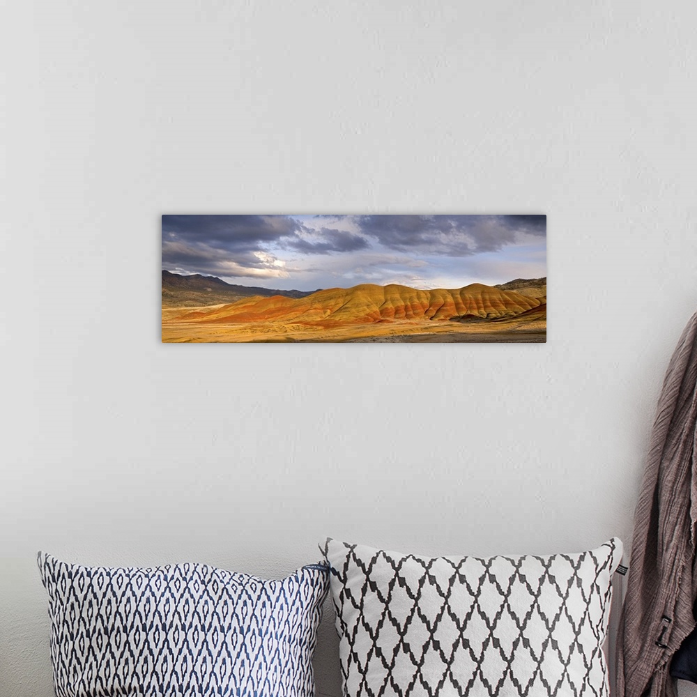 A bohemian room featuring USA, Oregon, John Day Fossil Beds National Monument. Panoramic of the Painted Hills and storm clo...
