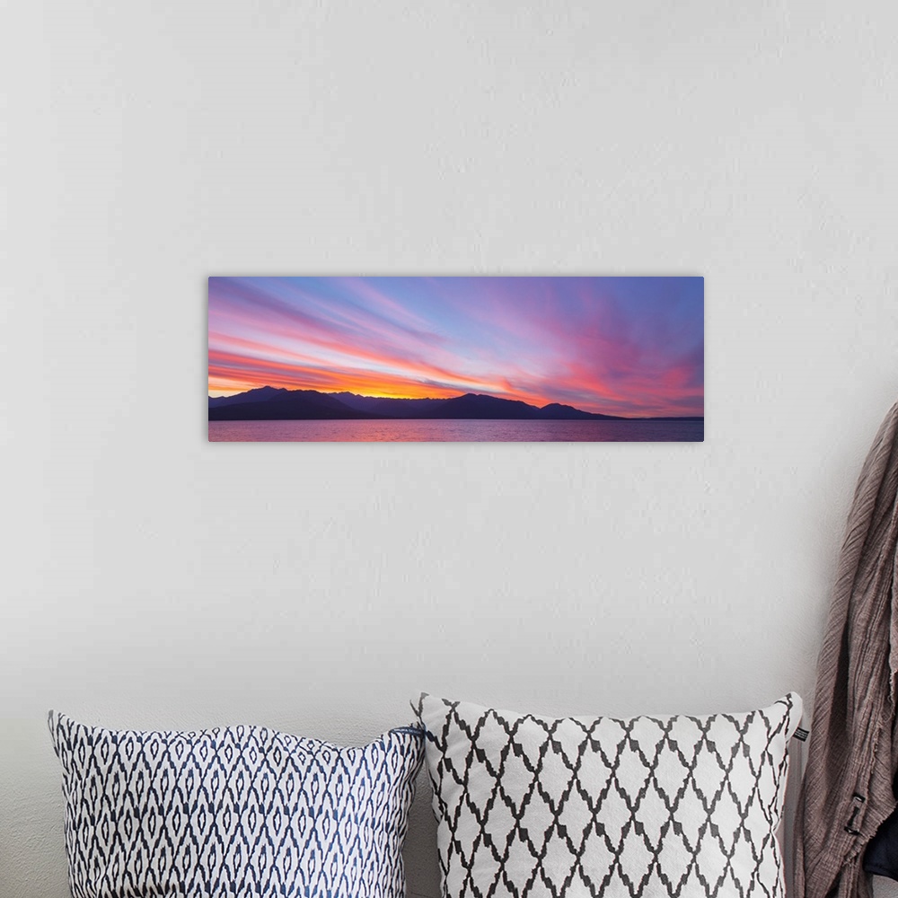 A bohemian room featuring USA, Washington, Seabeck. Sunset panoramic over the Olympic Mountains and Hood Canal.