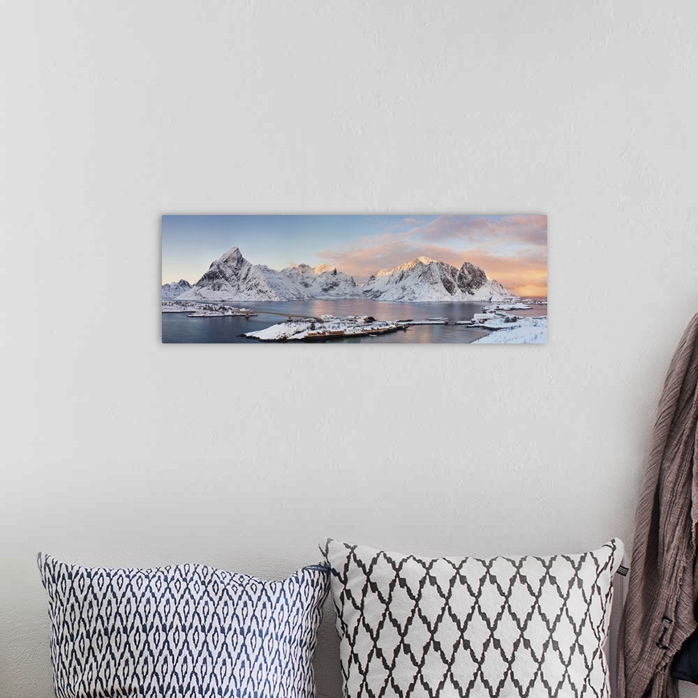 A bohemian room featuring Panaromic view of Reina and Hamnoy at the end of Lofoten Islands during winter sunset. Two villag...