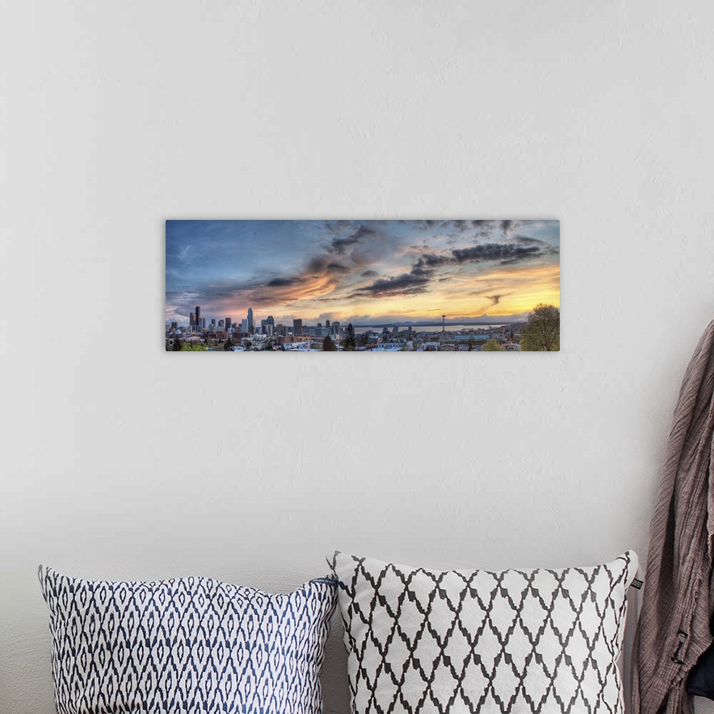 A bohemian room featuring Downtown Seattle skyline, Olympic Mountains, and Space Needle at sunset.